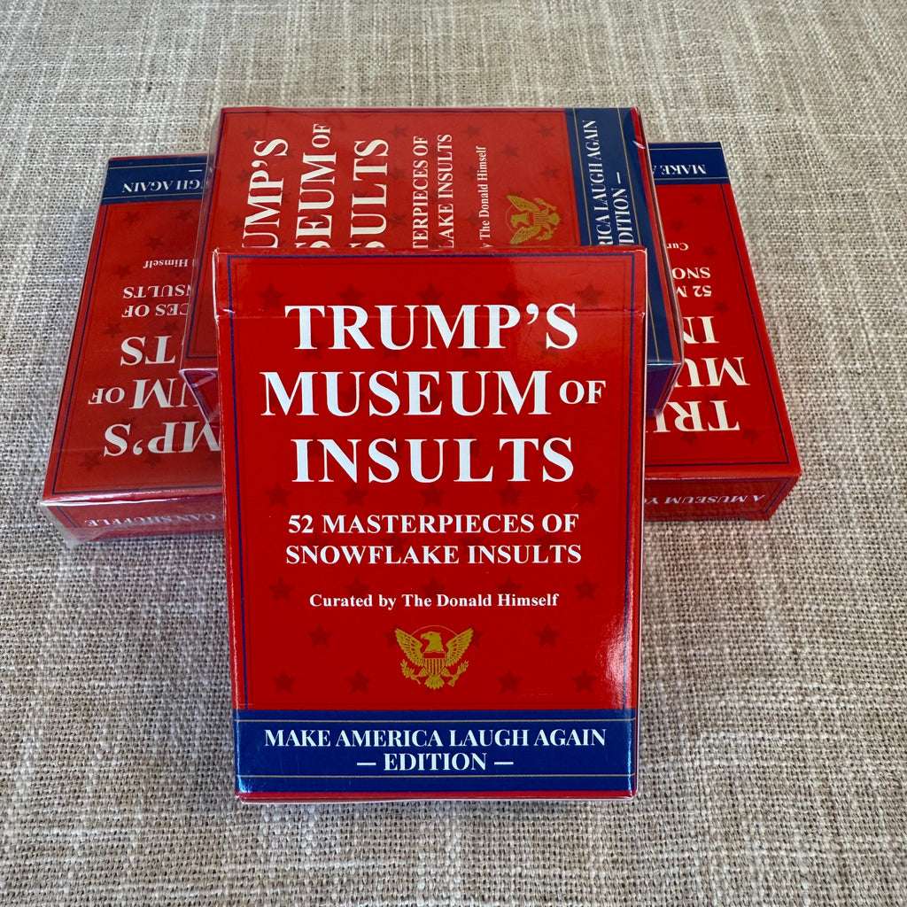 Red book titled 'Trump's Museum of Insults' on a textured gray surface